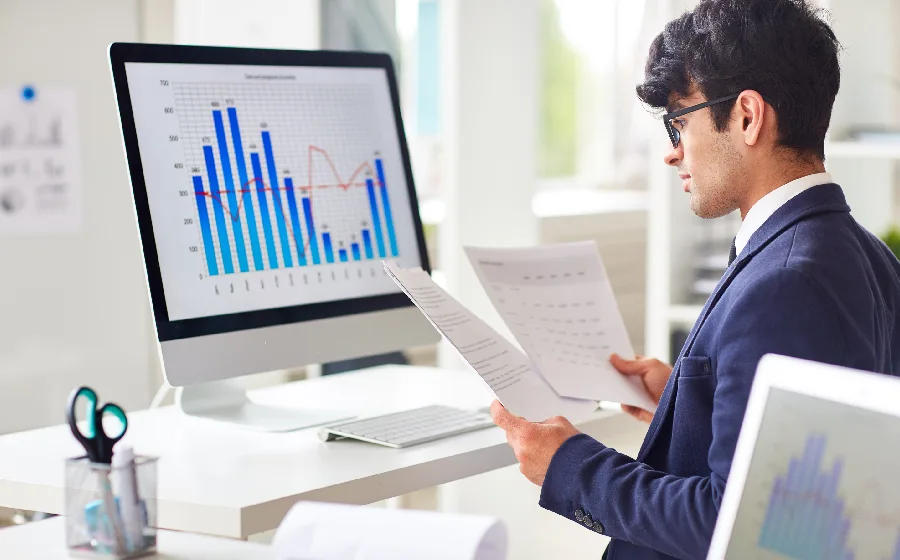 Laptop displaying charts and KPIs for business intelligence and analytics decision-making.